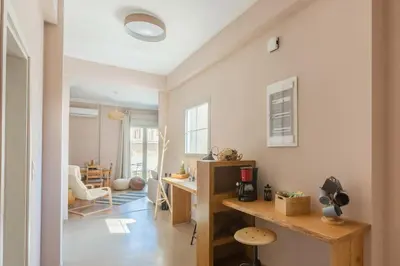 a home office with a desk and a table at 100m2 Luxury Apartment in the Heart of Athens - Living Stone Emerald in Athens