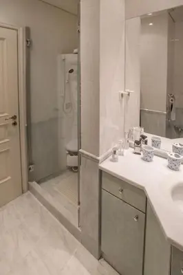 a bathroom with a sink and a shower at Exceptional Villa in Voula near the sea in Athens