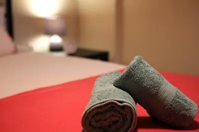 a folded up sock on a bed with a bedsenalsenalsenalsenalsenalangering at Kleisthenes' apartment in Athens