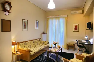 a living room with a couch and a table at Kleisthenes' apartment in Athens