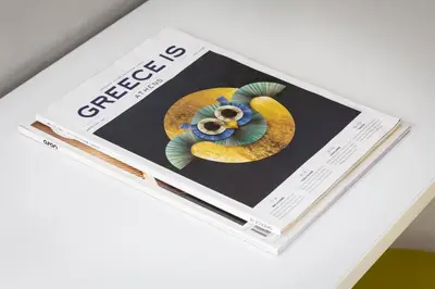 a magazine sitting on top of a table at Stay like a local next to Acropolis & Plaka! in Athens