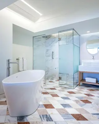 a bathroom with a tub and a shower and a sink at Niche Hotel Athens in Athens