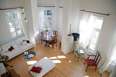 a living room with a table and a couch at Four Streets Athens - Luxury Suites Apartments in Athens in Athens