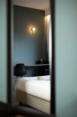 a bedroom with a bed and a lamp and a mirror at Athens21 in Athens