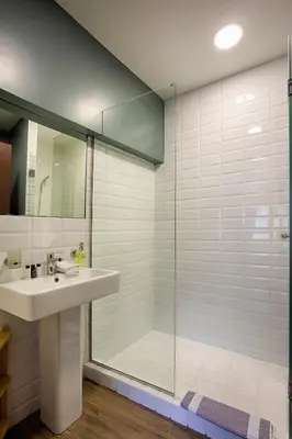 a bathroom with a sink and a shower at Athens21 in Athens