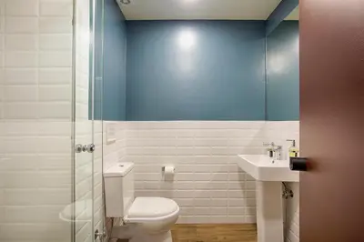 a bathroom with a toilet and a sink at Athens21 in Athens