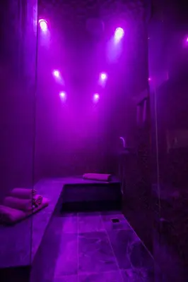 a bathroom with purple lights and a shower with a tub at Zambelis Athens Penthouse Spa in Athens
