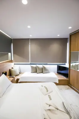 a bedroom with two beds in a room at Zambelis Athens Penthouse Spa in Athens