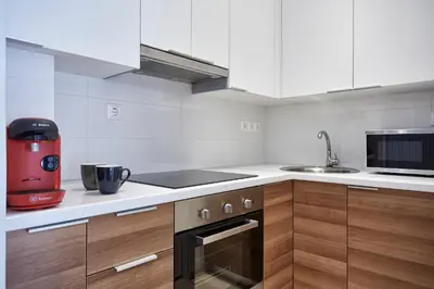 a kitchen with a red appliance on the counter at Modern Elegant Apt at Kolonaki in Athens