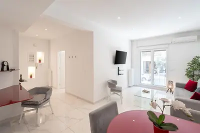 a living room with a couch and a table at Sophisticated Modern Apt in Athens center in Athens