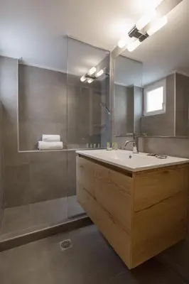 a bathroom with a sink and a shower at Charming Apartment few steps from Acropolis by GHH in Athens