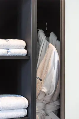 a closet with white towels in a closet at Athens One Smart Hotel in Athens