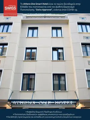a white building with windows on the side of it at Athens One Smart Hotel in Athens
