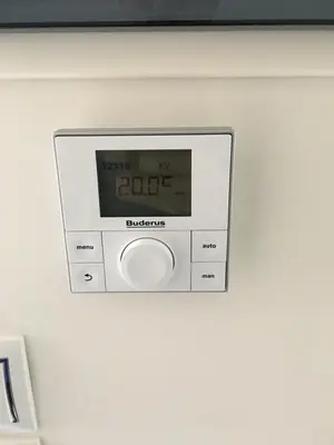 a clock hanging on a wall in a room at Metro Fix Cosy Apartment in Athens