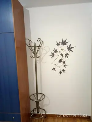 a black and white wall with a bird and flowers on a wall at Modern, ideally located studio apartment in Athens