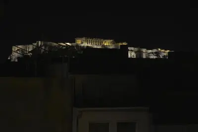 a view of the acropolis lit up at night at Mosaics Central aprtm with Acropolis View ! in Athens