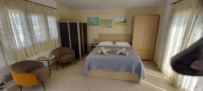 a bedroom with two teddy bears on a bed at Sunny Elegant Studio in Athens
