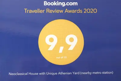 a flyer for a travel review awards with a yellow circle at Neoclassical House with Unique Athenian Yard (nearby metro station) in Athens