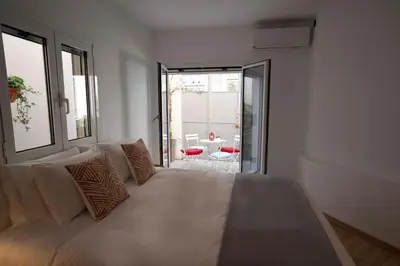a bedroom with a large bed with pillows on it at Modern 2bed 2bath loft in Acropolis area in Athens