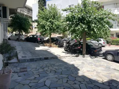 a group of cars parked in a parking lot at Modern 2bed 2bath loft in Acropolis area in Athens