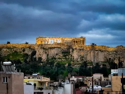 a building on the side of a mountain at Modern 2bed 2bath loft in Acropolis area in Athens