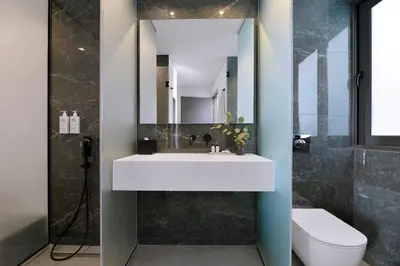 a bathroom with a sink and a mirror at The Editor Hotel Athens in Athens