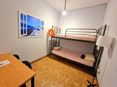 a room with two bunk beds and a table at SleepEasy City center in Athens