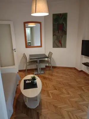 a living room with a table and a couch at Omonia Square Apartment in Athens