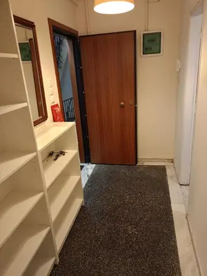 a room with a closet and a door with a rug at Omonia Square Apartment in Athens