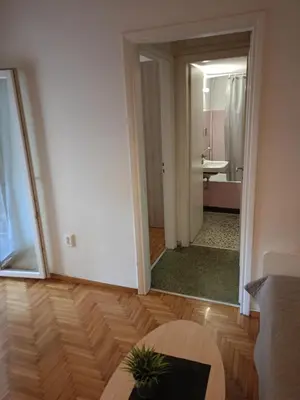 a living room with a mirror and a bathroom at Omonia Square Apartment in Athens