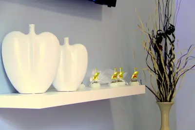 a shelf with three white vases on it at Studio NATASHA without PARKING in Athens