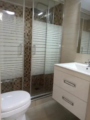 a bathroom with a toilet and a shower and a sink at Studio NATASHA without PARKING in Athens