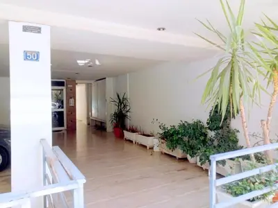 a hallway with potted plants in a building at Studio NATASHA without PARKING in Athens