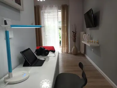 a room with a desk with a black chair in it at Studio NATASHA without PARKING in Athens
