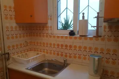 a kitchen with a sink and a window at Apartment by Sepolia Metro-Ησυχη γκαρσονιερα κοντα στο Μετρό in Athens