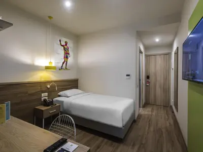 a hotel room with a bed and a tv at ibis Styles Athens Routes in Athens