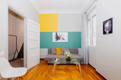 a living room with a couch and a table at Acropolis Apartments in Athens