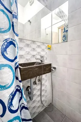 a bathroom with a sink and a mirror at Athens metro apartment in Athens