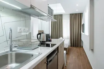 a kitchen with a sink and a counter top at My Athens Place in Athens