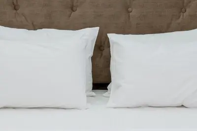two white pillows sitting on top of a bed at My Athens Place in Athens