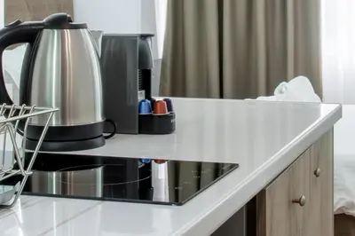 a counter top with a coffee maker on it at My Athens Place in Athens
