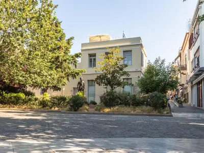 a white building on the side of a street at Kyria Boutique House in Athens