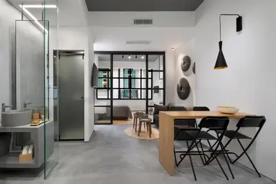 a kitchen and dining room with a table and chairs at La Maison Athenes in Athens