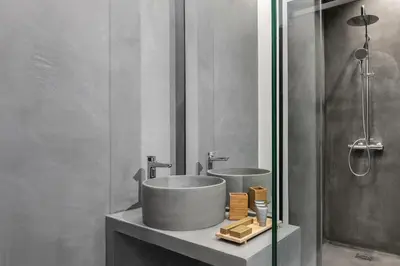 a bathroom with a sink and a mirror at La Maison Athenes in Athens