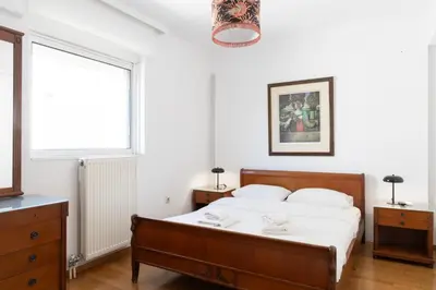a bedroom with a bed and a window at Luxury and Spacious apt for 8 guests New features April 2025 in Athens