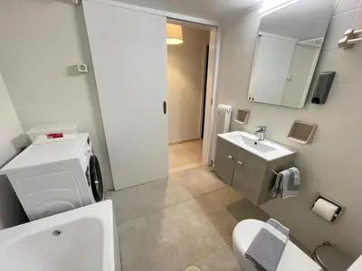 a bathroom with a toilet and a sink at Kleio - Spacious apartment in Glyfada in Athens