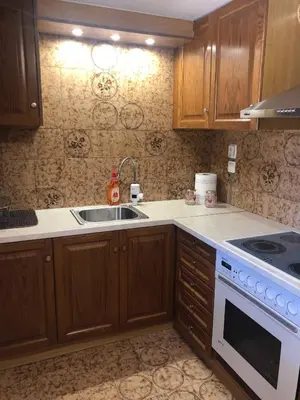 a kitchen with a sink and a stove at Your Holiday House in Porto Rafti
