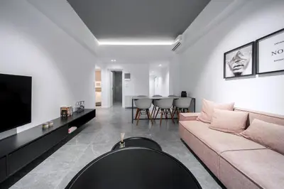 a living room with a couch and a tv at Heritage Boutique Apartments in Athens