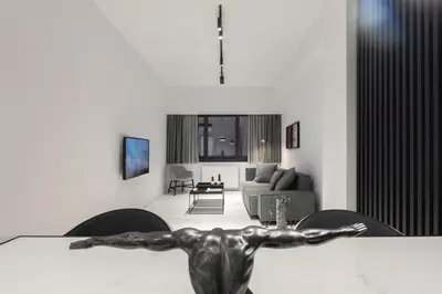 a living room with a table with a metal man on it at Heritage Boutique Apartments in Athens