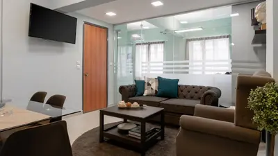 a living room with a couch and a table at Monastiraki Urban Apartments in Athens